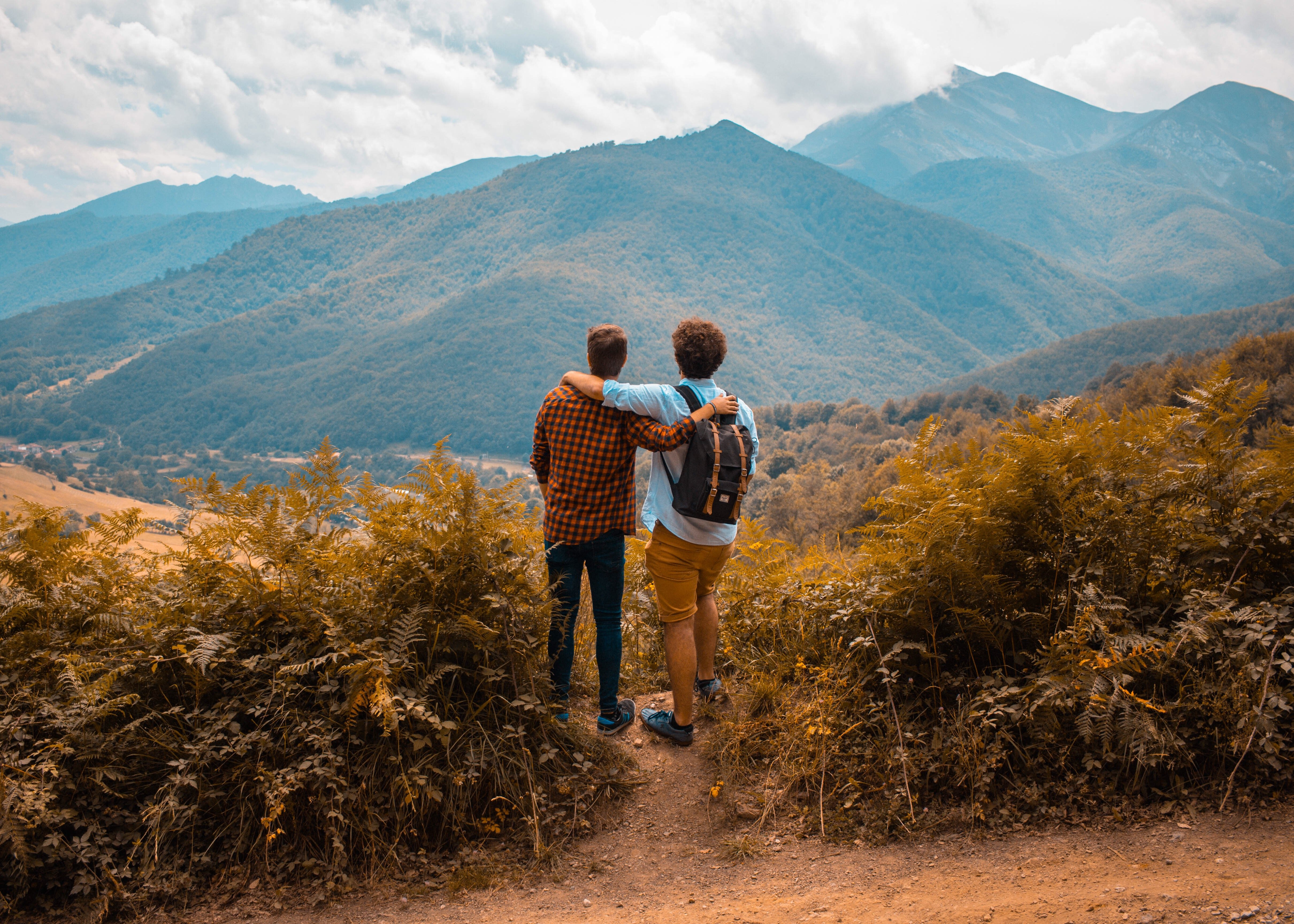 two men looking out at the mountains