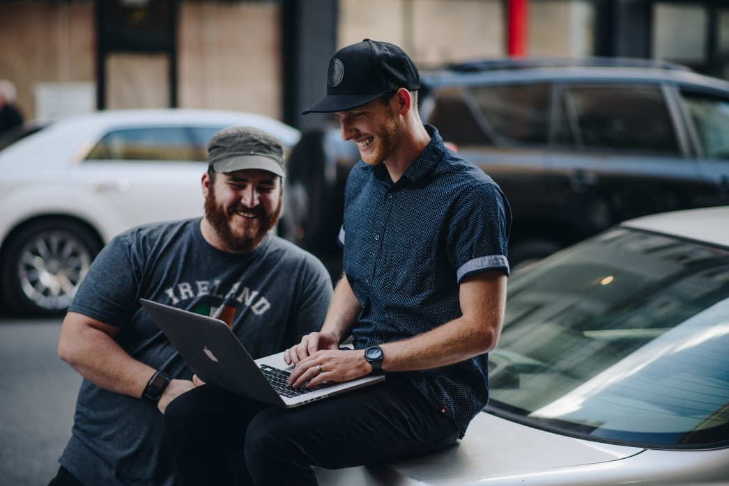 Two men having fun while conducting persona research